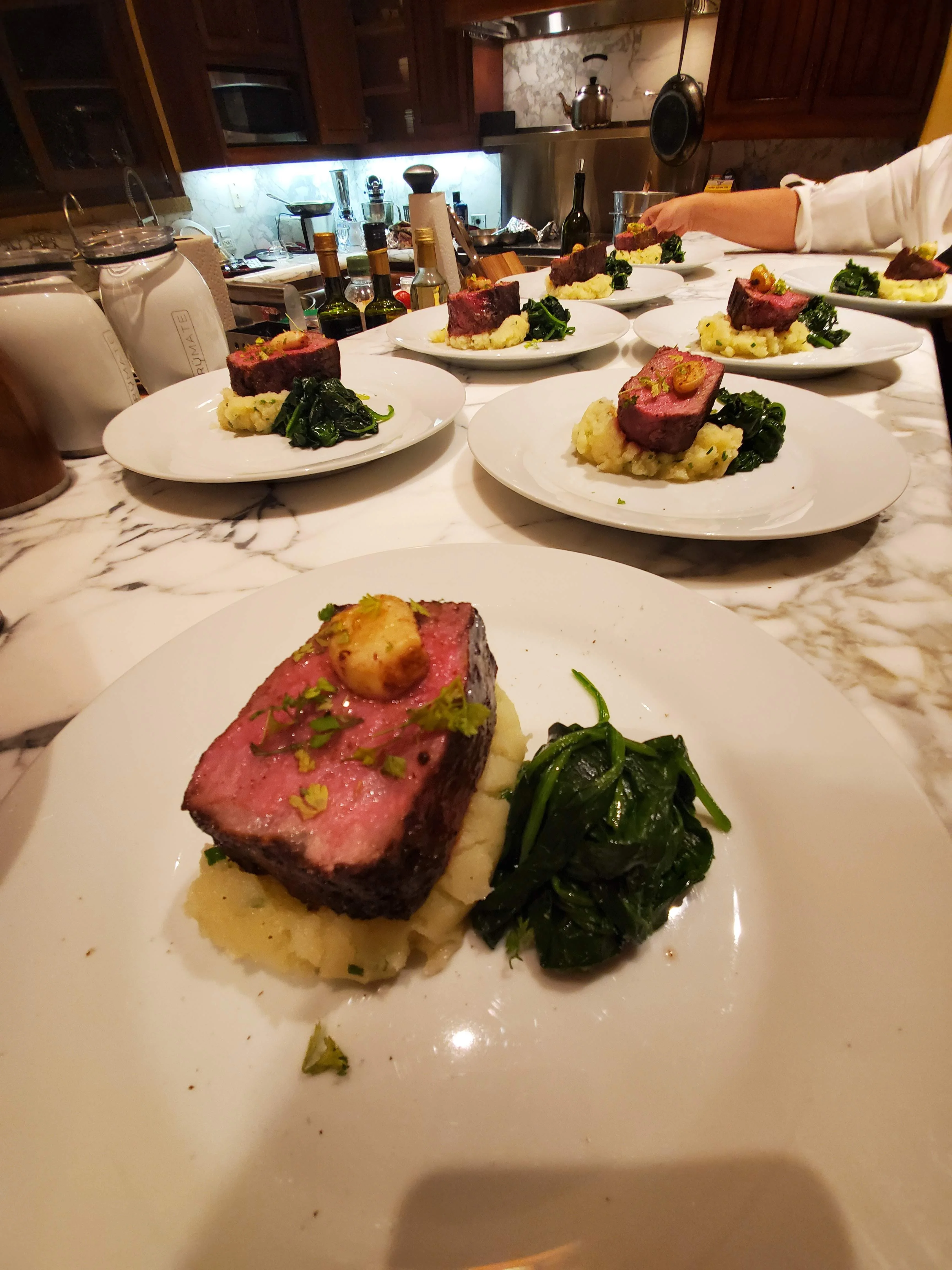 Beef tenderloin filets plated with potato puree and sautéed spinach at a Napa Valley private dinner