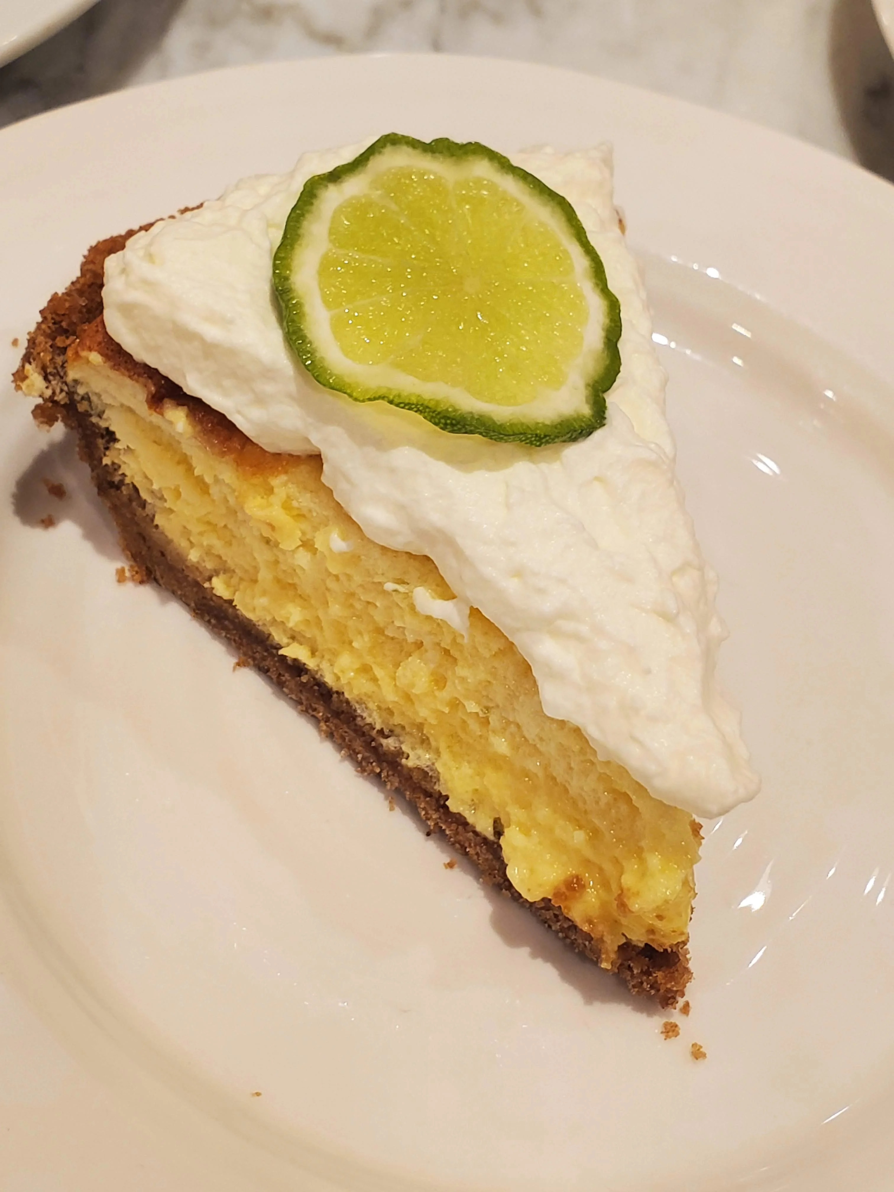 House-made key lime tart with whipped cream and candied lime at a Napa Valley private dinner